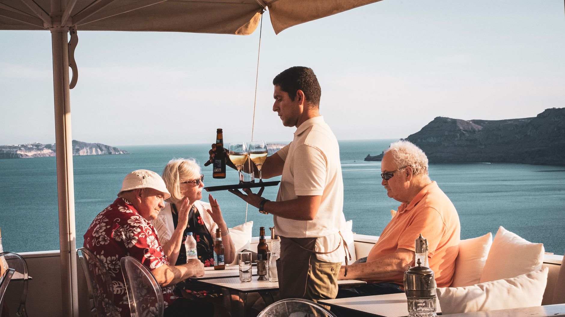 Enjoy a relaxing meal with a stunning sea view in Fira, Santorini.